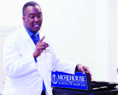  a doctor talks in front of a lectern